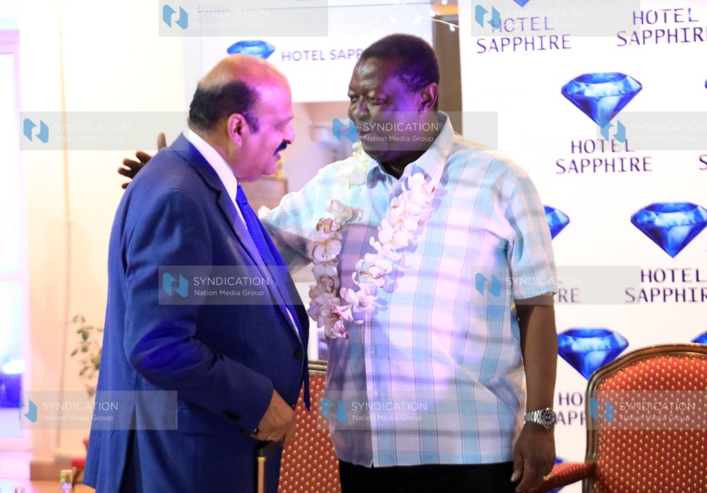 Prime Cabinet Secretary Musalia Mudavadi and businessman Alnoor Jiwan