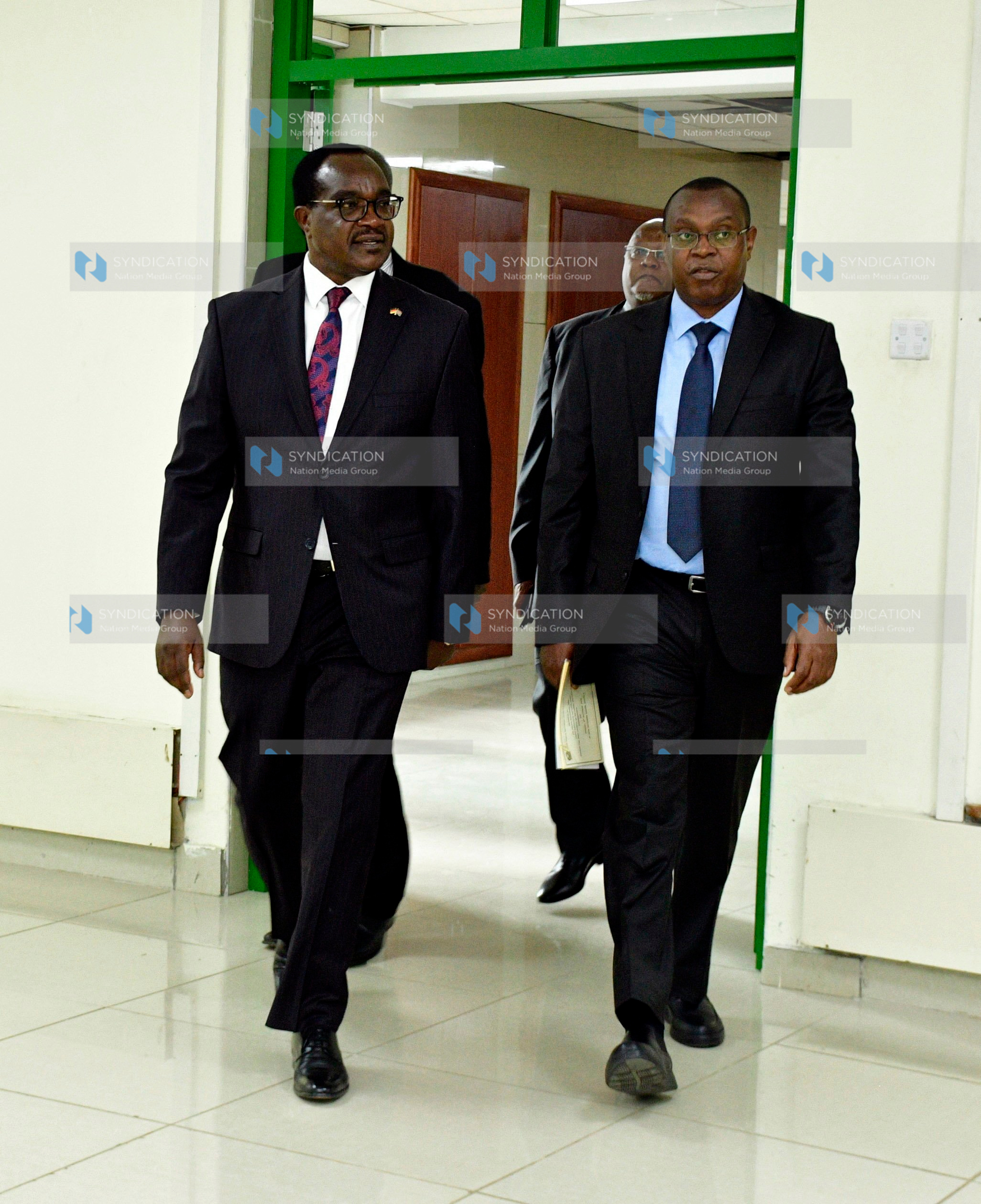 Kenya National Examination Council (KNEC) CEO Dr. David Njengere and Ministry of Education Cabinet Secretary Julius Migos Ogamba