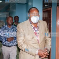 Former Kiambu Governor Ferdinand Waititu (front) with co-accused businessman Charles Chege being escorted to Milimani Law Courts
