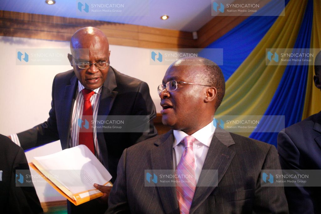 Health cabinet secretary James Macharia and Kenya medical practitioners and dentists board CEO Daniel Yumbia