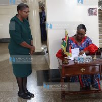 Chief Justice Martha Koome appends signature on documents