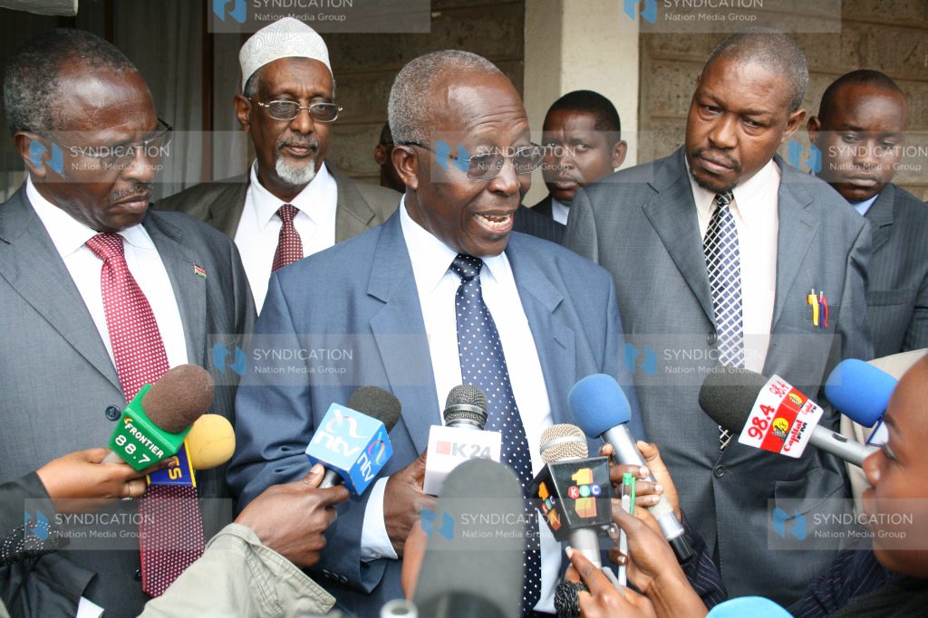 Education Minister Professor Sam Ongeri (centre) address the press