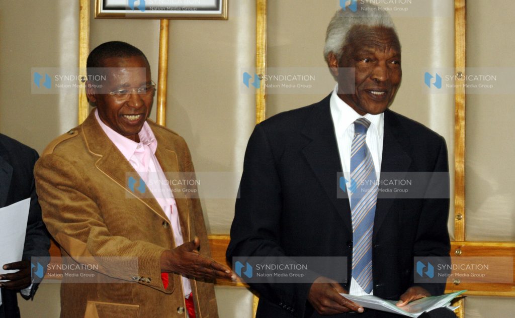 Truth, Justice and Reconciliation Commission Chairman Bethwel Kiplagat, (right) arrives for a press conference