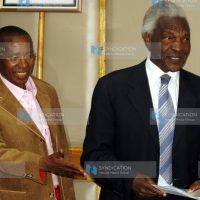 Truth, Justice and Reconciliation Commission Chairman Bethwel Kiplagat, (right) arrives for a press conference