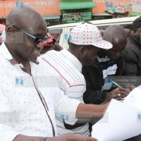 Ekuru Aukot (in glasses) collected signatures from members of the public