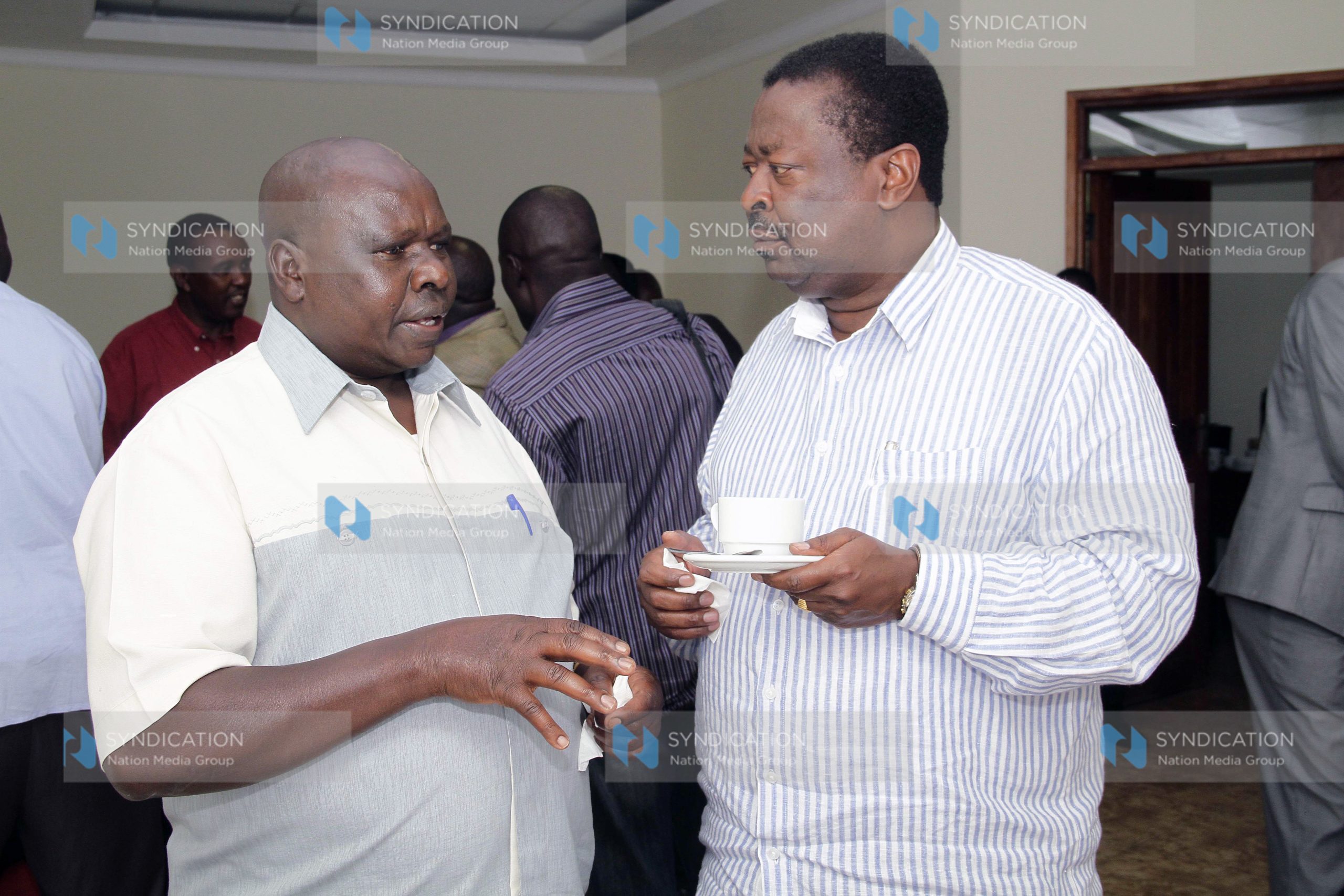 Musalia Mudavadi confers with Mark Too (left) during the Amani Coalition retreat