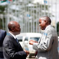 Joseph Ole Lenku (right) chats with Kiambu Governor William Kabogo at KICC