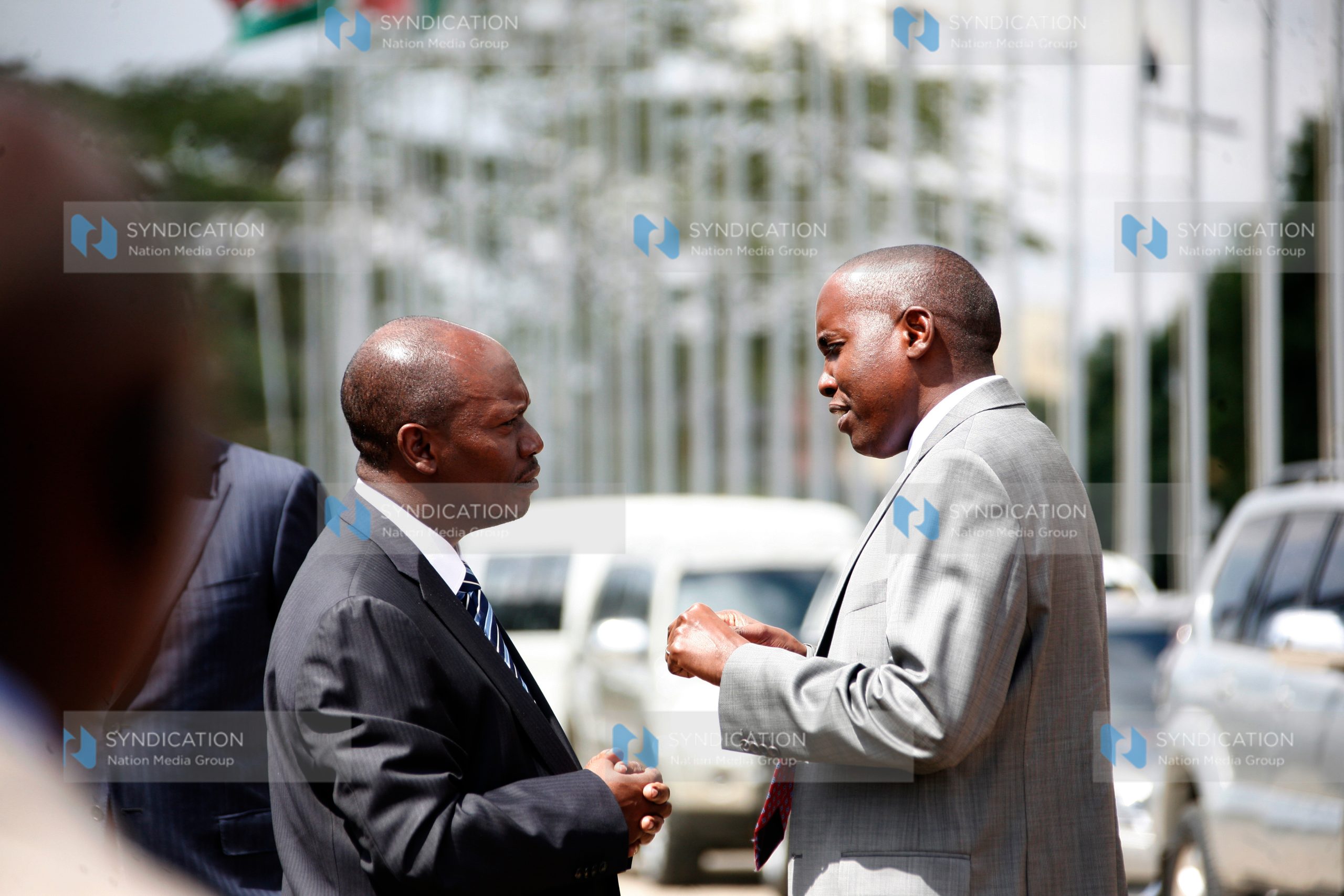 Joseph Ole Lenku (right) chats with Kiambu Governor William Kabogo at KICC