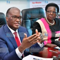 James Macharia (left) gestures while addressing a delegation