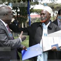 Gudliye farm chairman Issack Abdullahi Maalim receives the group's award for being winners of the 2012 UN in Kenya