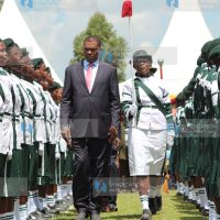 Justin Muturi inspects a parade of honour staged by Nyabururu Girls’ National School