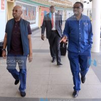 Senator James Orengo (right) with businessman Jimi Wanjigi arrives at Jomo Kenyatta International Airport