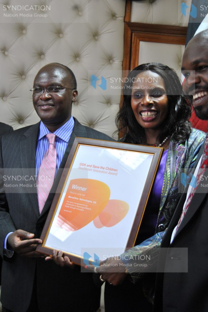 Health cabinet secretary James Macharia (left) with Micro Clinic Technology founder Mary Matu