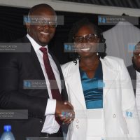 Outgoing LSK President Eric Theuri congratulates his successor Faith Odhiambo
