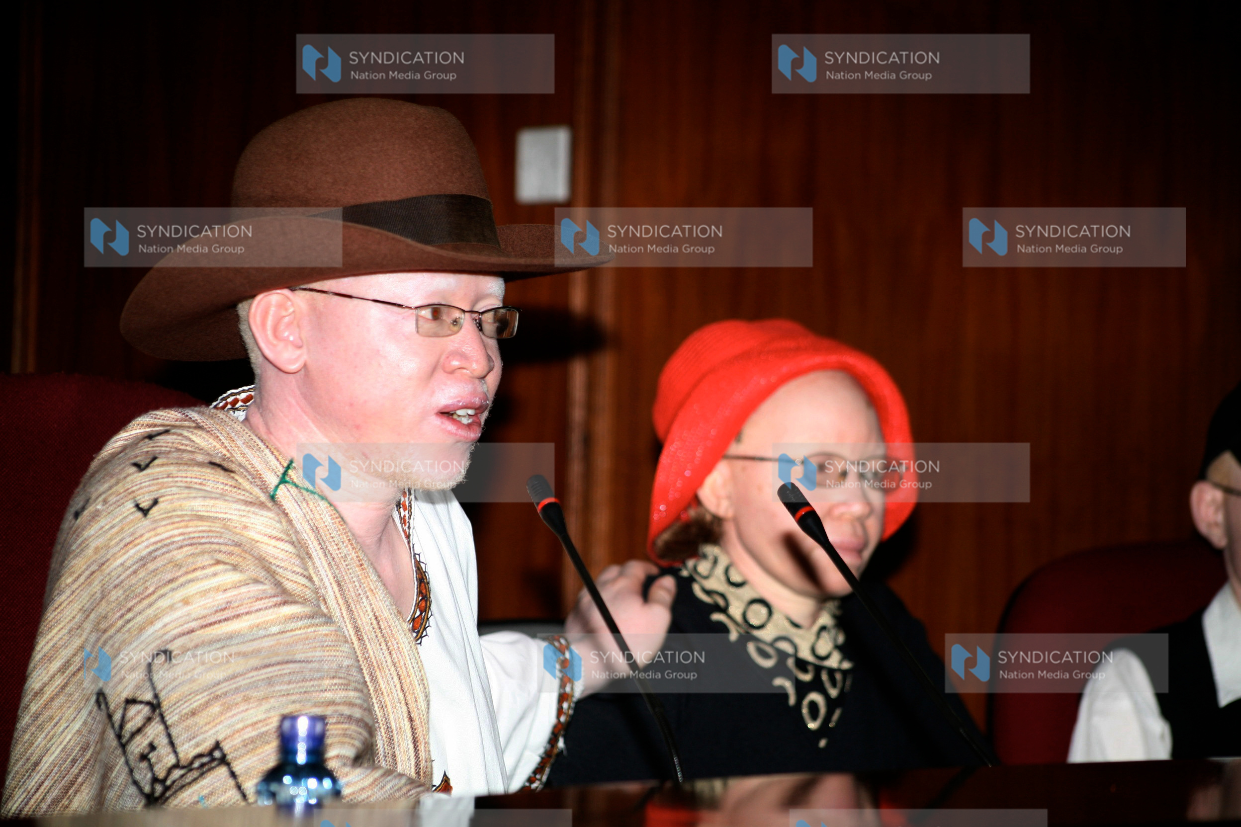 Albinism Society of Kenya National Coordinator Isaac Mwaura introduces his colleague Lydia Mugure