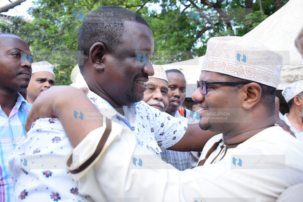 Kwale Governor Salim Mvurya (left) consoles Former Mombasa Senator Hassan Omar (right)