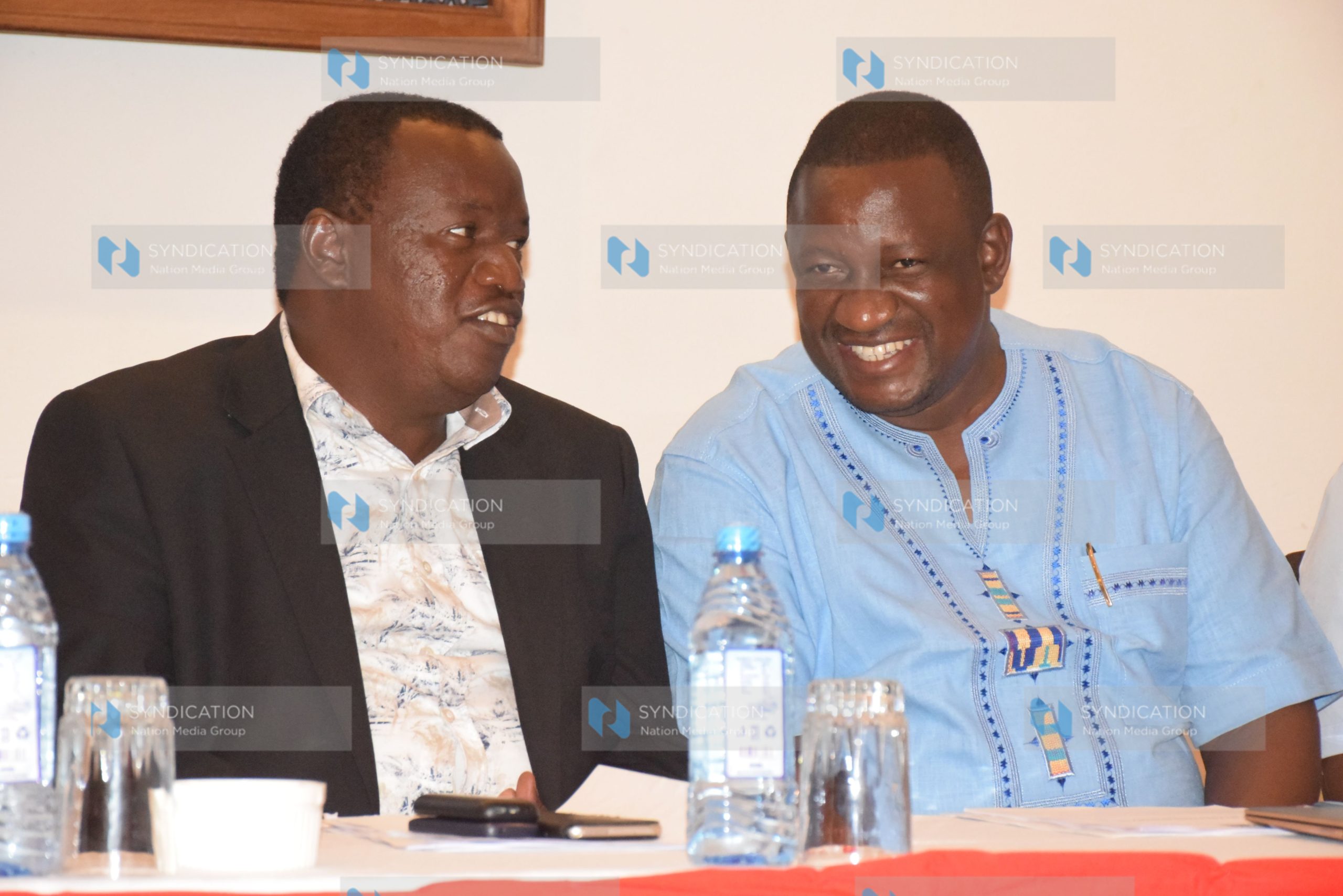 Devolution Principal Secretary Charles Sunkuli (L) speaks with Kwale Governor Salim Mvurya