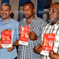 Abdulswamad Nassir, display copies of the report on the radicalization of youths in the Coast region at MUHURI offices