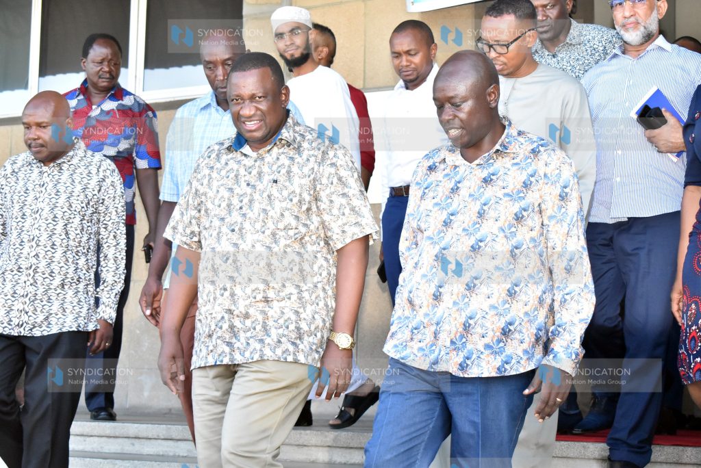 Deputy President Rigathi Gachagua, Blue Economy Cabinet Secretary Salim Mvurya (C) and other leaders leave the Bandari Maritime Academy
