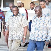 Deputy President Rigathi Gachagua, Blue Economy Cabinet Secretary Salim Mvurya (C) and other leaders leave the Bandari Maritime Academy