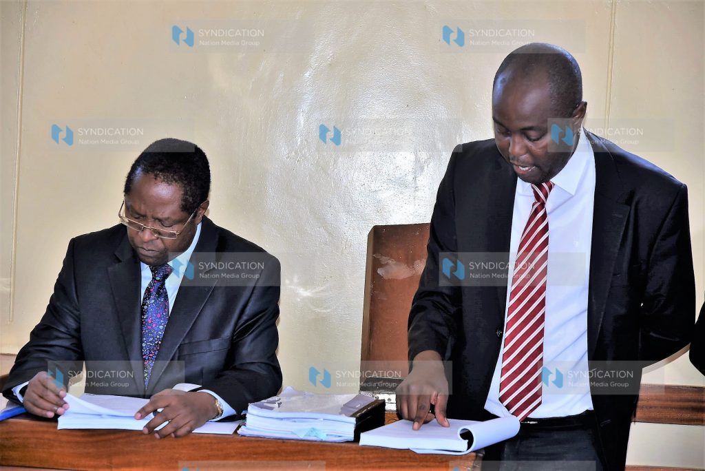 Lawyer Kithinji Marete (right) guides Governor Martin Wambora while testifying in an election petition challenging his election