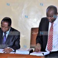 Lawyer Kithinji Marete (right) guides Governor Martin Wambora while testifying in an election petition challenging his election