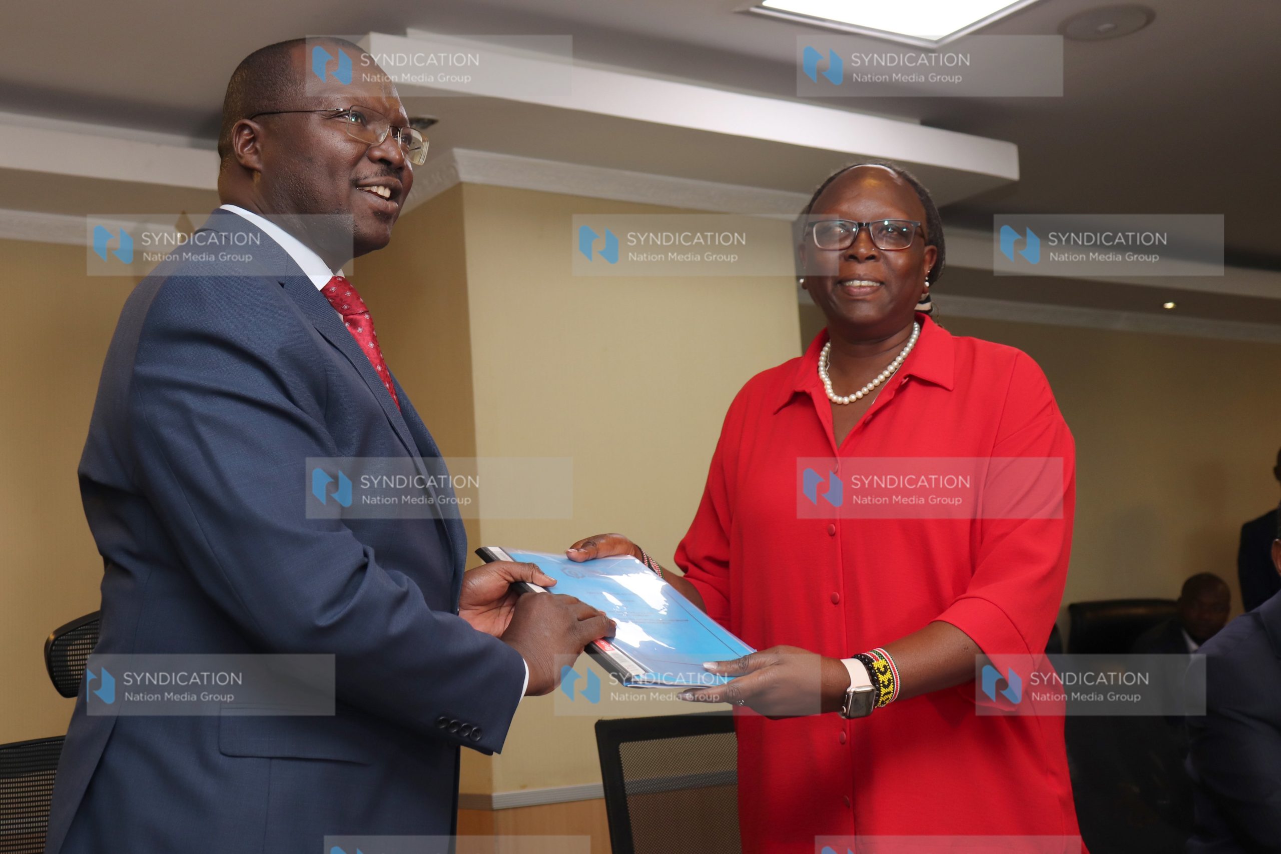 CS Betty Maina handing over to the Incoming Cooperatives and Micro, Small and Medium Enterprise (MSMES) CS Simon Chelugui