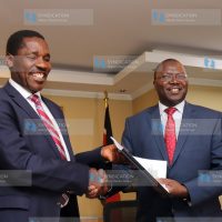 Outgoing Agriculture CS Peter Munya (left) handing over to the Incoming Cooperatives and Micro, Small and Medium Enterprise (MSMES) CS Simon Chelugui