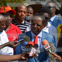 Embu Governor Martin Wambora (in a blue suit), together with his supporters, addresses the press