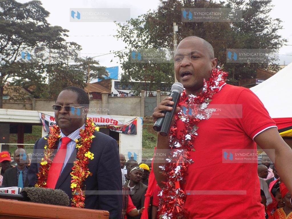 Josiah Thiriku (right) addresses members of the public