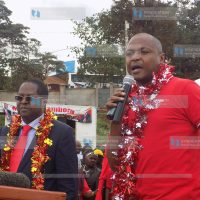 Josiah Thiriku (right) addresses members of the public