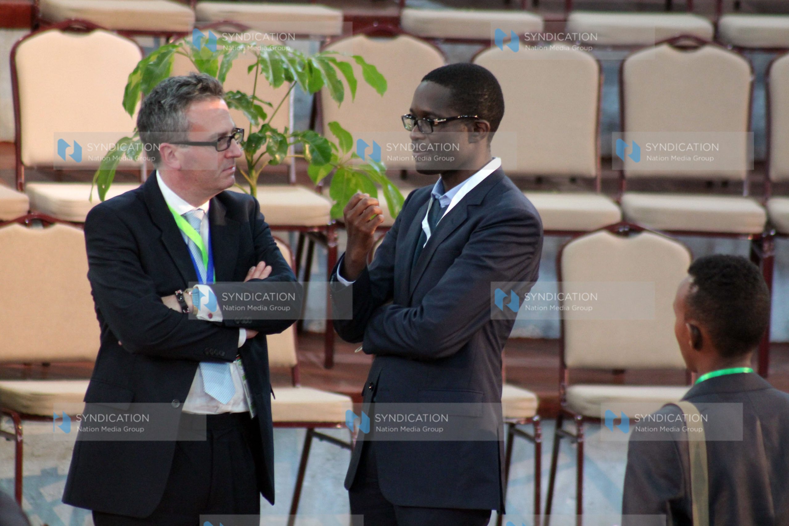 Ezra Chiloba shares a word with British High Commissioner Nick Hailey
