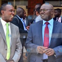 KEWI Chairman Col. Benjamin Mwema confers with Water CS Simon Chelugui