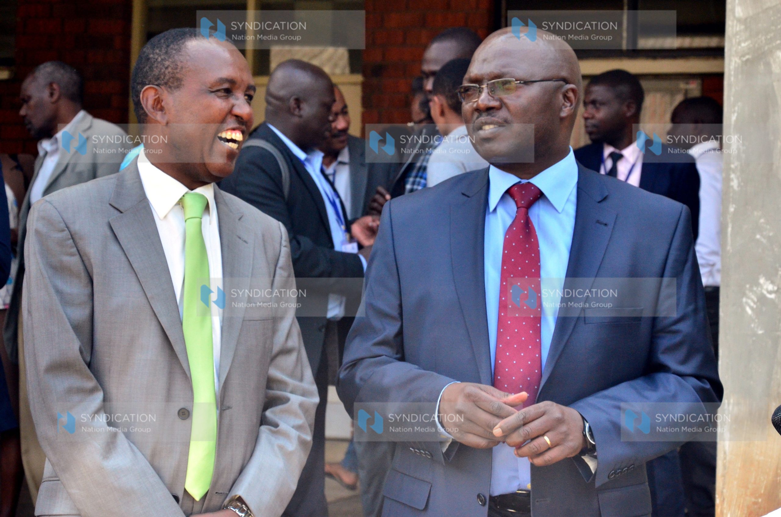 KEWI Chairman Col. Benjamin Mwema confers with Water CS Simon Chelugui