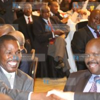 Outgoing Council of Governors (CoG) Chair Isaac Ruto with incoming Council Chair Peter Munya