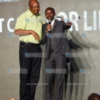 Jamii Telcom limited Chairman Joshua Chepkwony with ICT Cabinet Secretary Joe Mucheru