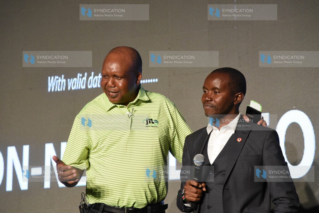 Jamii Telcom limited Chairman Joshua Chepkwony with ICT Cabinet Secretary Joe Mucheru