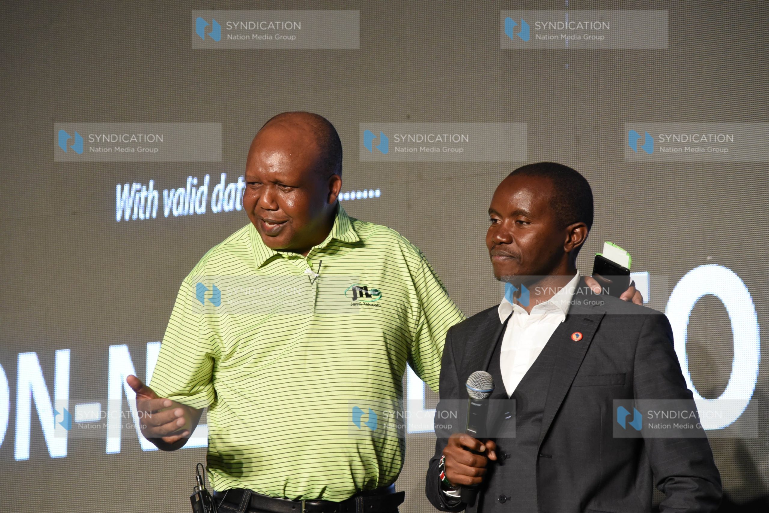 Jamii Telcom limited Chairman Joshua Chepkwony with ICT Cabinet Secretary Joe Mucheru