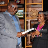 Nation Media Group Chief Executive Officer Stephen Gitagama with KenGen Acting Managing Director and CEO Rebecca Miano
