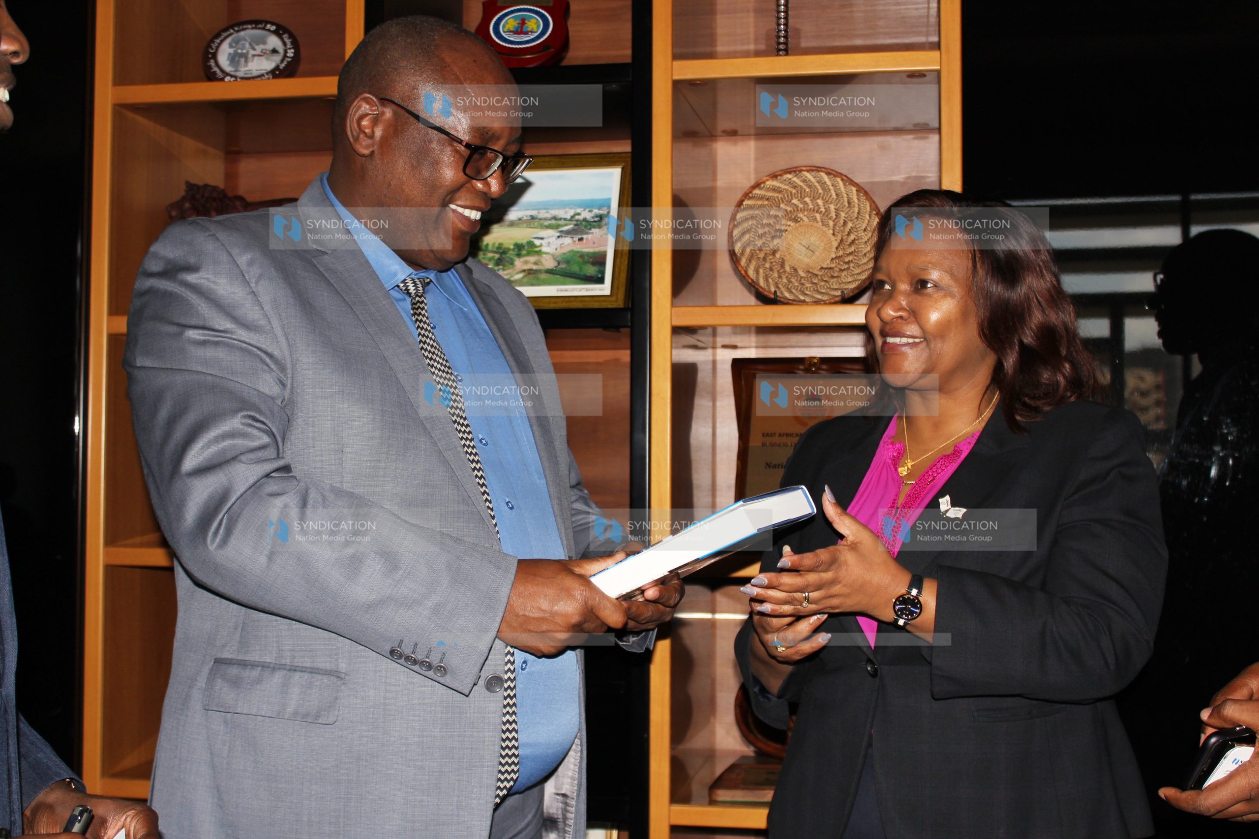 Nation Media Group Chief Executive Officer Stephen Gitagama with KenGen Acting Managing Director and CEO Rebecca Miano