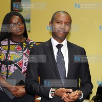 ICT Cabinet Secretary Joe Mucheru receives a gift from Kenya Film Commission Chairperson Dorothy Ghettuba