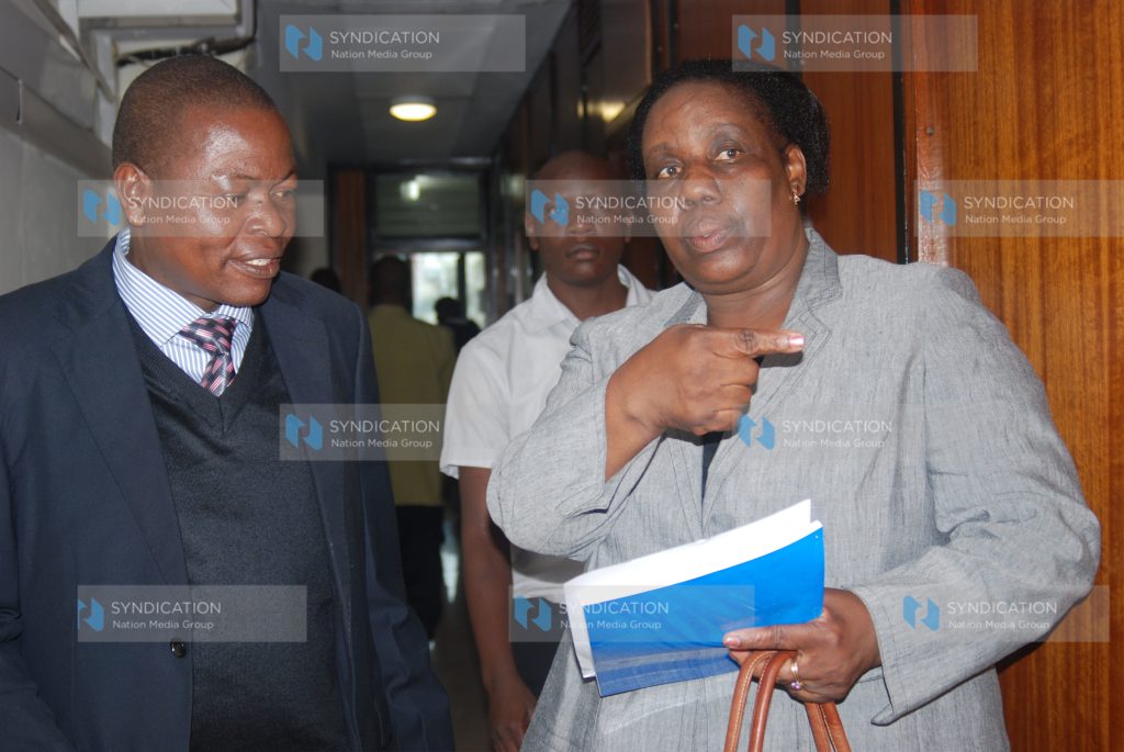 KUPPET secretary general Akelo Misori consults with their advocate Judith Guserwa