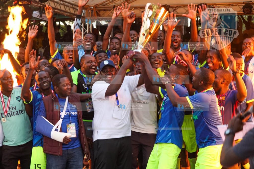 MP of Ikolomani Benard Shinali and Senator of Kakamega Cleophas Malala celebrate with players of Lirhembe Arsenal FC