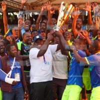 MP of Ikolomani Benard Shinali and Senator of Kakamega Cleophas Malala celebrate with players of Lirhembe Arsenal FC