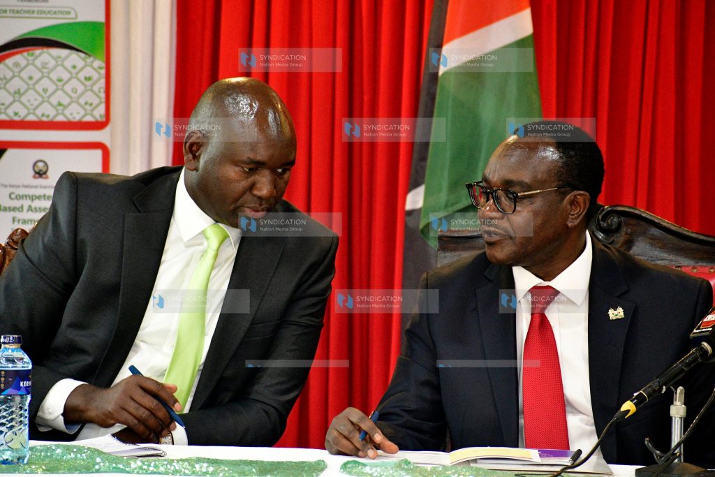 Education Cabinet Secretary Julius Migos confers with State Department for Basic Education Principal Secretary Julius Bitok