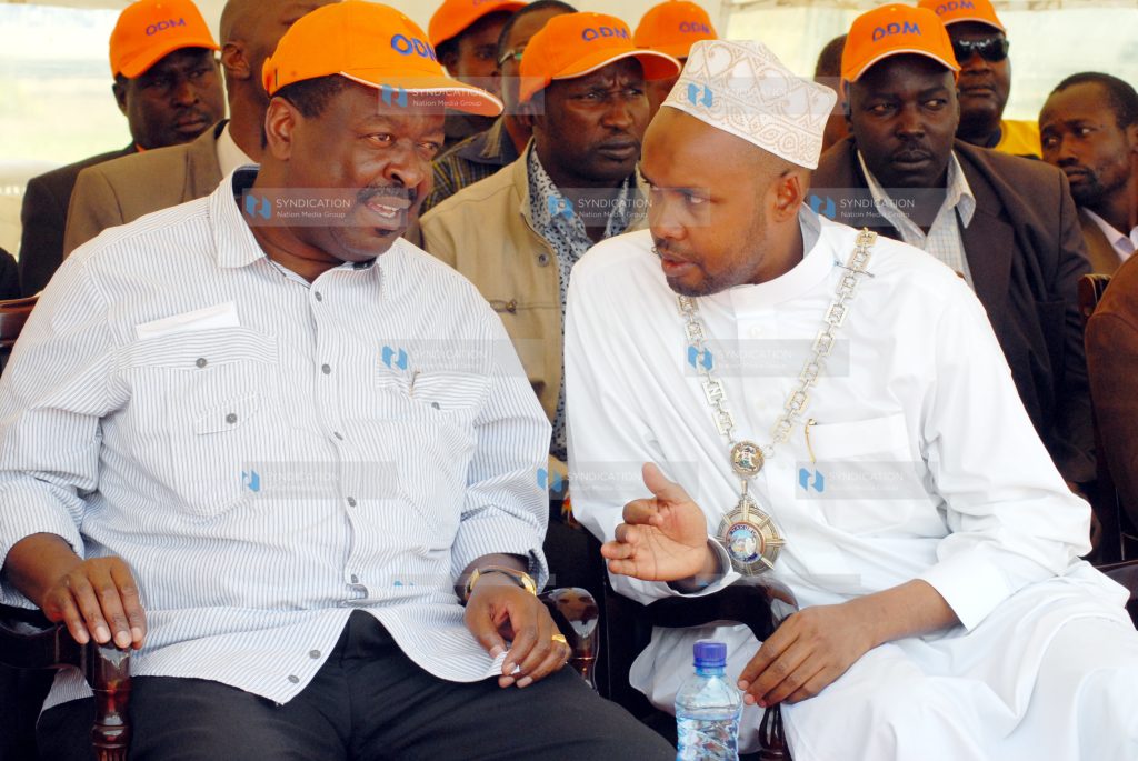 Deputy Prime Minister Musalia Mudavadi confers with Nakuru Mayor Mohamed Suraw