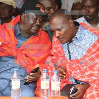 CORD leader Raila Odinga share a word with the ODM Chairman John Mbadi