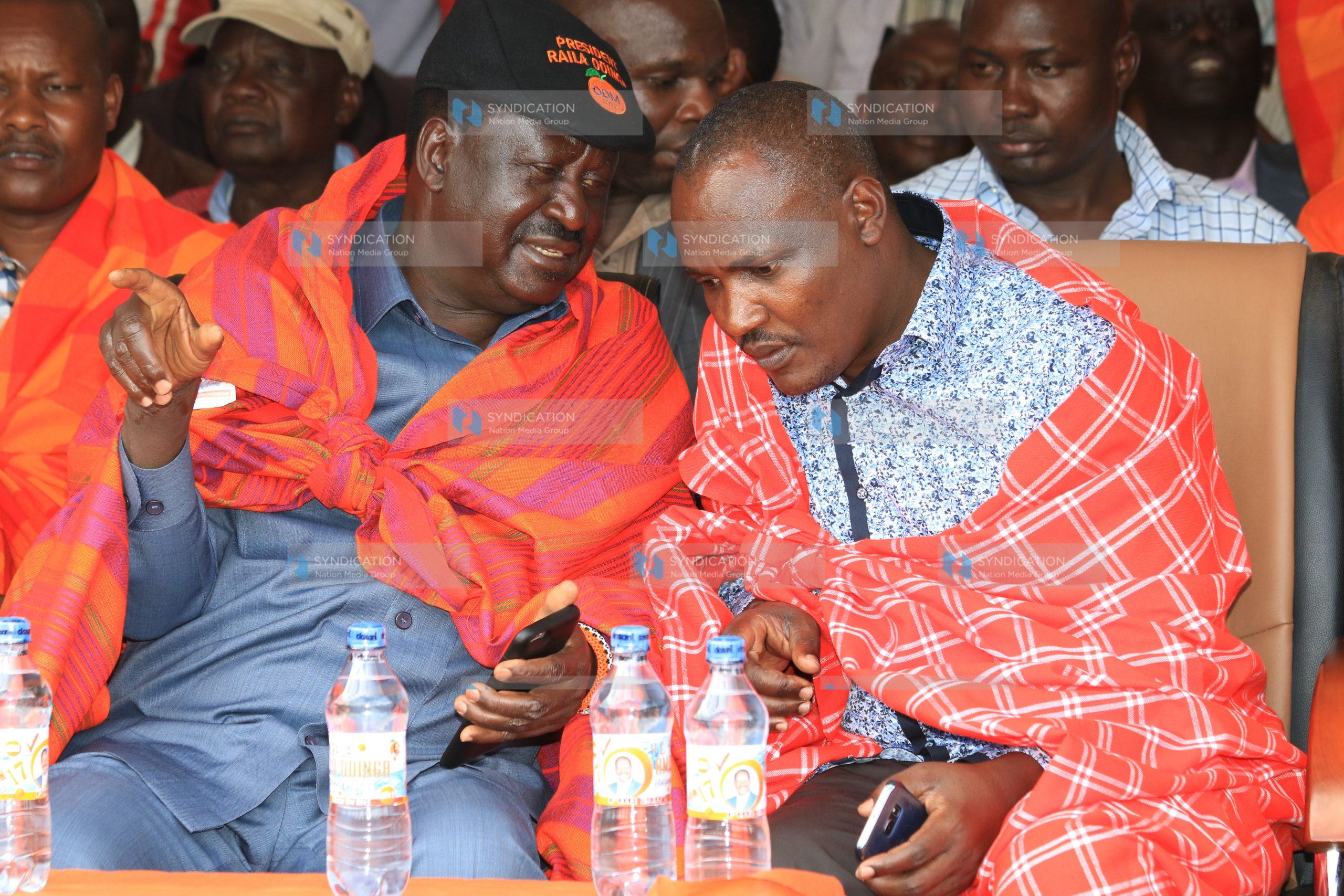 CORD leader Raila Odinga share a word with the ODM Chairman John Mbadi