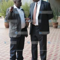 Public Service Minister Dalmas Otieno chats with Chepalungu MP Isaac Ruto