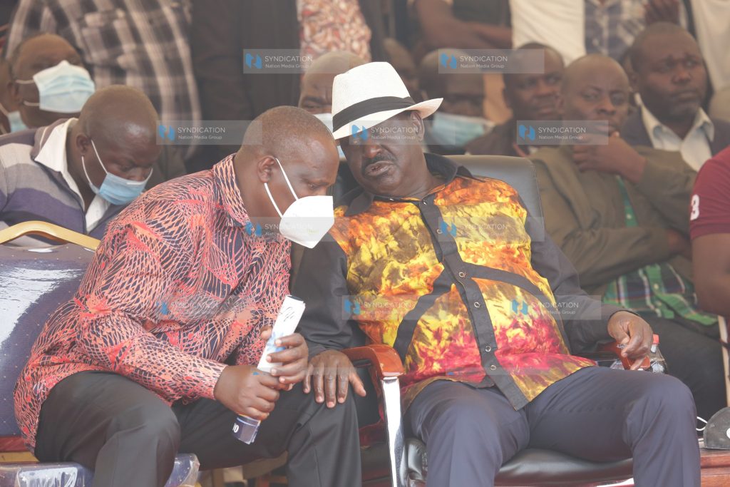 ODM Chairman John Mbadi consult his party leader Raila Odinga